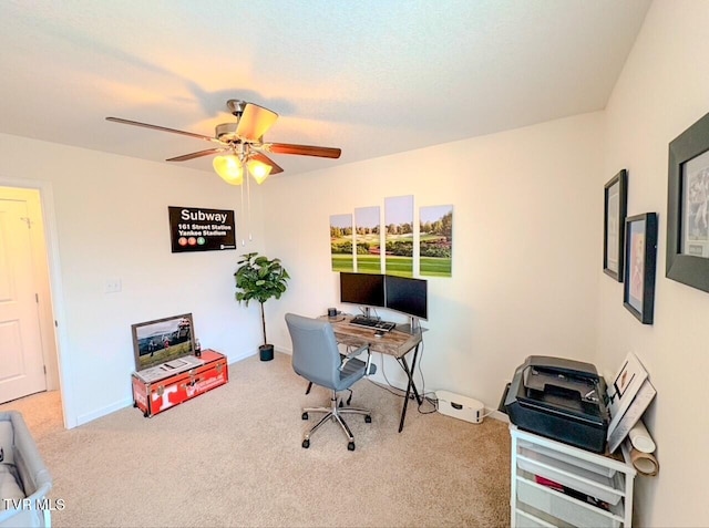 office area featuring ceiling fan and light colored carpet