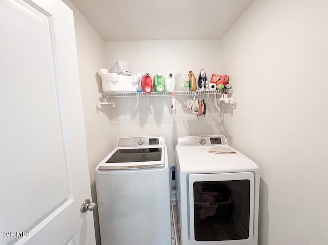 laundry area with separate washer and dryer