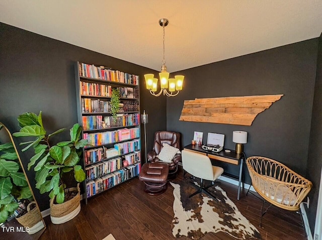 office with a notable chandelier and dark hardwood / wood-style flooring