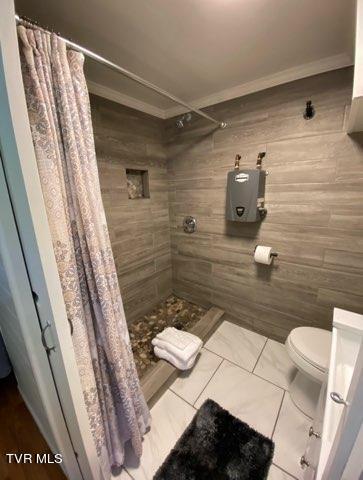 bathroom with toilet and walk in shower