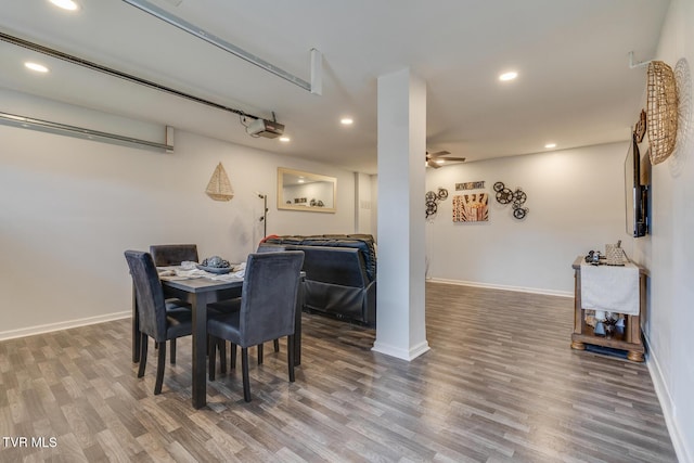 dining space featuring hardwood / wood-style flooring and ceiling fan