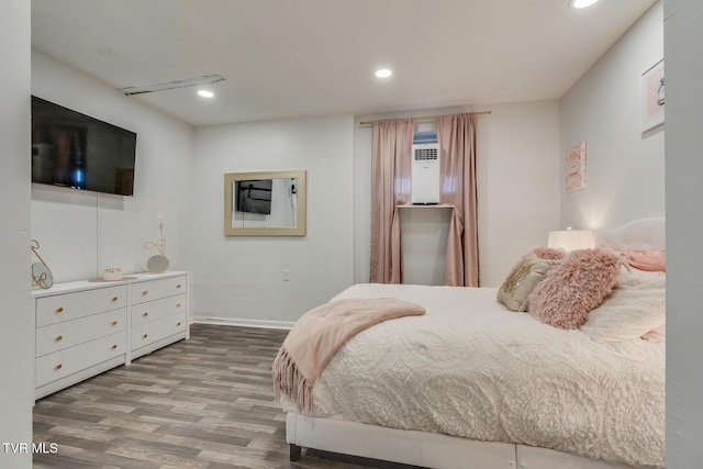 bedroom with hardwood / wood-style floors