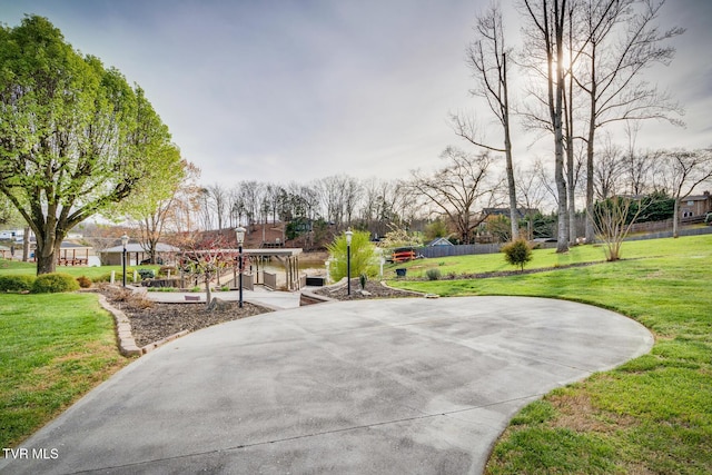 view of property's community with a lawn