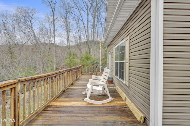 wooden deck with a mountain view