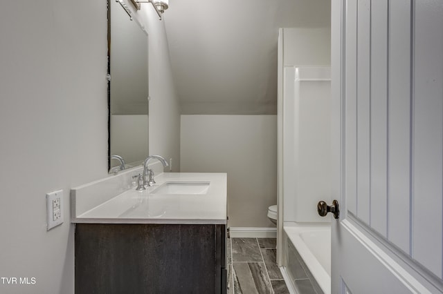 full bathroom with vanity, toilet, and washtub / shower combination