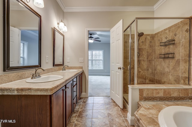 bathroom featuring vanity, tile patterned flooring, crown molding, and shower with separate bathtub