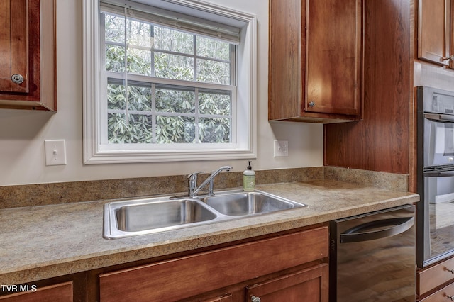 kitchen featuring dishwasher and sink