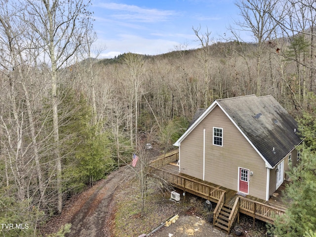 view of property exterior featuring a deck