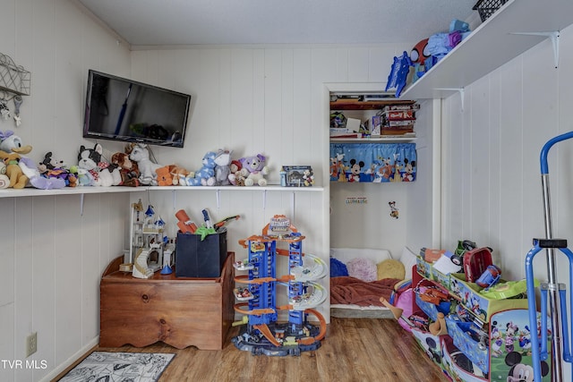 bedroom with hardwood / wood-style flooring