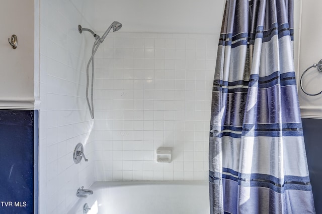 bathroom with shower / bathtub combination with curtain