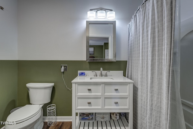 bathroom featuring vanity, toilet, curtained shower, and wood-type flooring