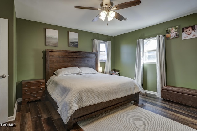 bedroom featuring dark wood-type flooring and ceiling fan