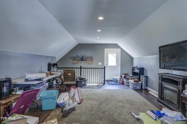 additional living space with wood-type flooring and lofted ceiling