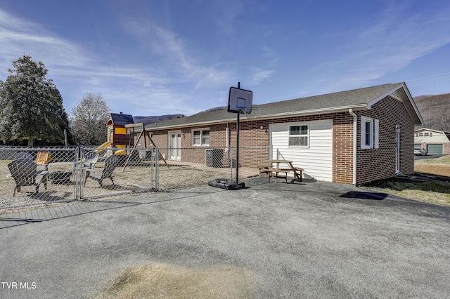 rear view of house with a playground