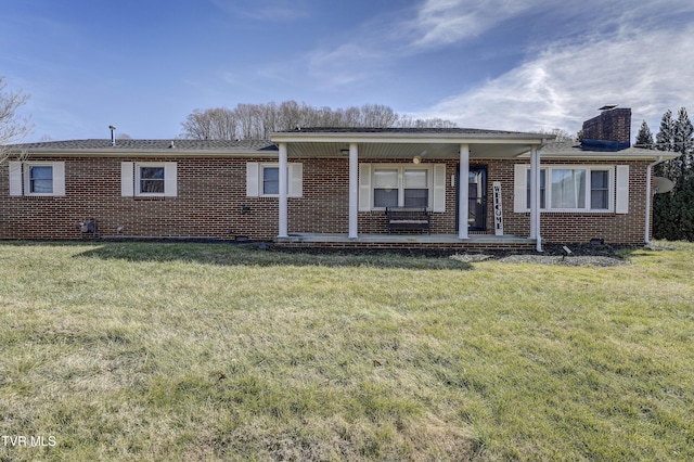 ranch-style home with a porch and a front yard