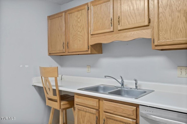 kitchen featuring dishwasher, sink, and light brown cabinets