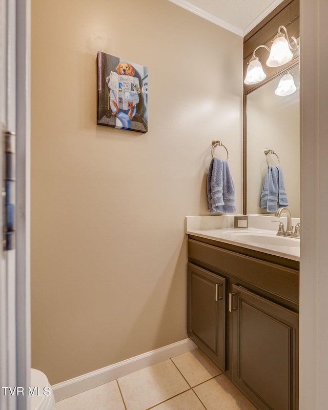 bathroom featuring tile patterned flooring, vanity, and ornamental molding