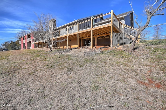 rear view of property with a deck