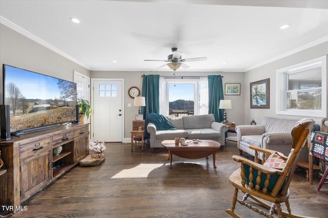 living room with dark wood-type flooring, ceiling fan, and ornamental molding