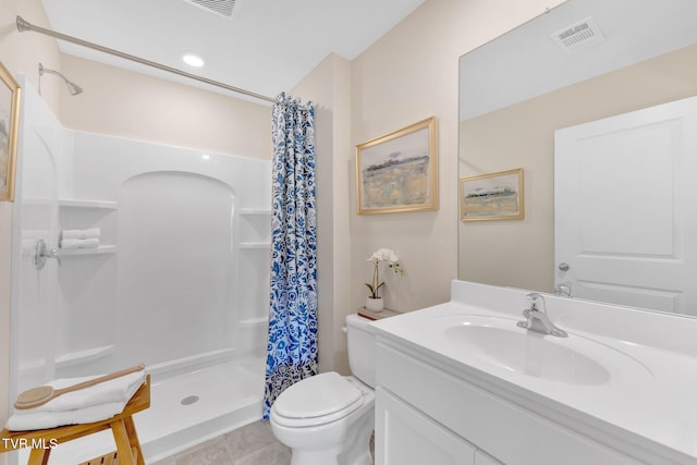 bathroom featuring vanity, a shower with curtain, and toilet