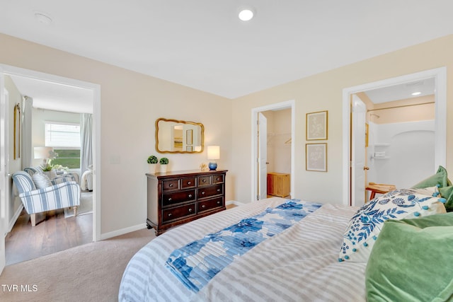 carpeted bedroom with a spacious closet