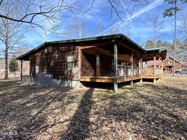 view of side of home featuring central AC