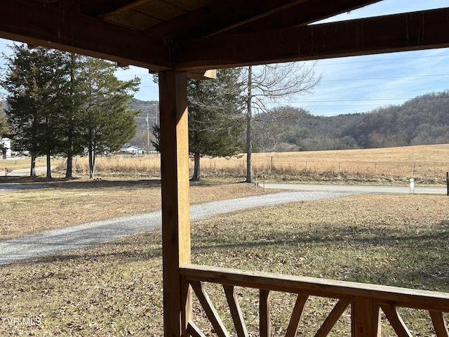 view of yard with a rural view