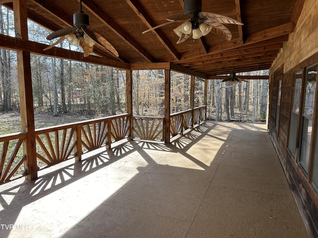 unfurnished sunroom featuring lofted ceiling and ceiling fan