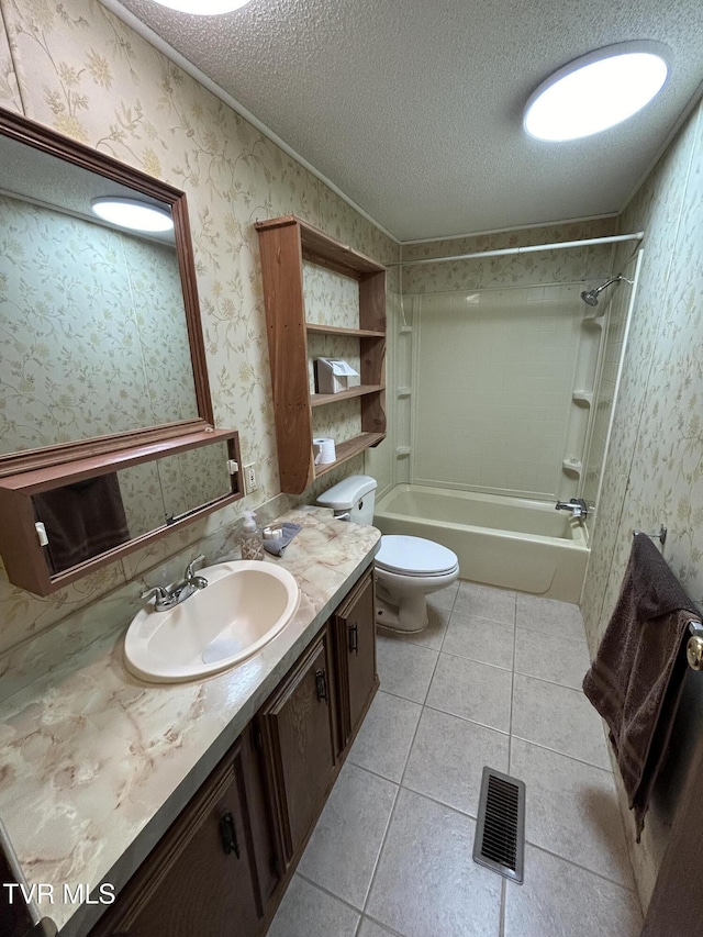 full bathroom with tile patterned floors, toilet, a textured ceiling, shower / tub combination, and vanity