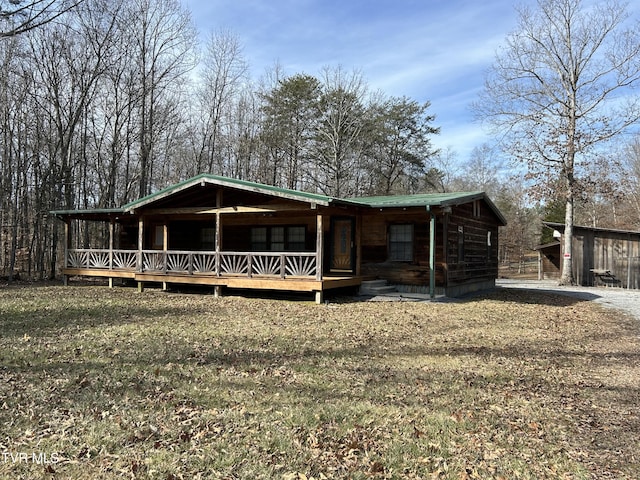 view of front of home with a front lawn and covered porch