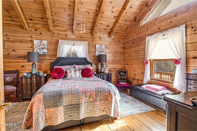 bedroom featuring wood ceiling, wood walls, light wood-type flooring, and vaulted ceiling with beams