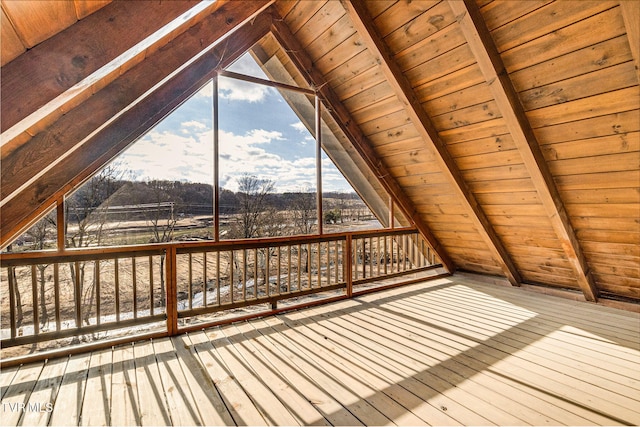 additional living space featuring lofted ceiling with beams, hardwood / wood-style floors, and wooden ceiling