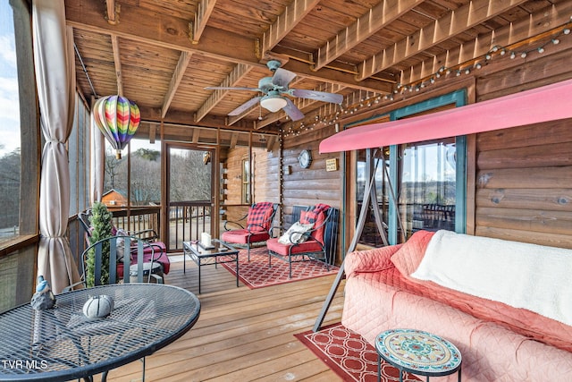 sunroom / solarium with ceiling fan, beam ceiling, and wooden ceiling