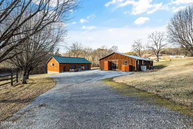 exterior space with an outbuilding and a garage