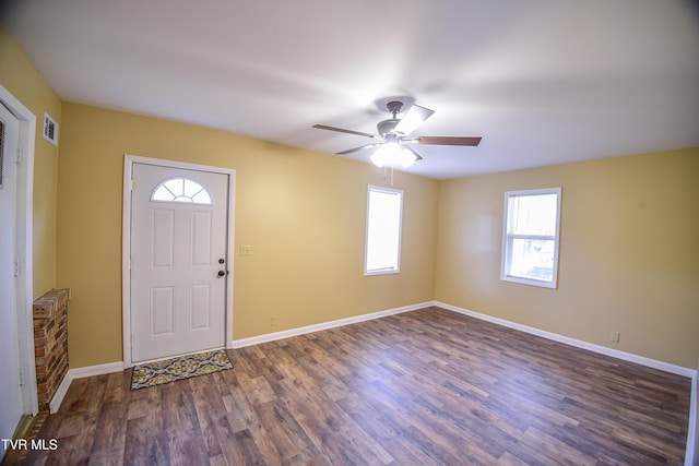 foyer with dark hardwood / wood-style flooring and ceiling fan