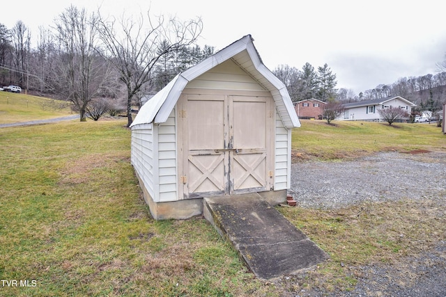 view of outdoor structure featuring a yard