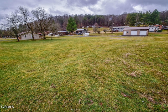 view of yard featuring a garage