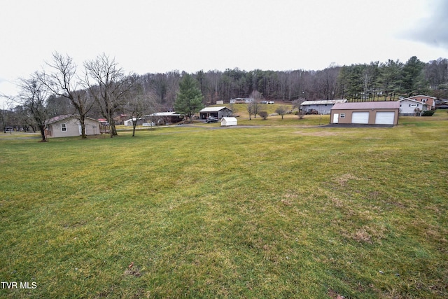 view of yard featuring a garage