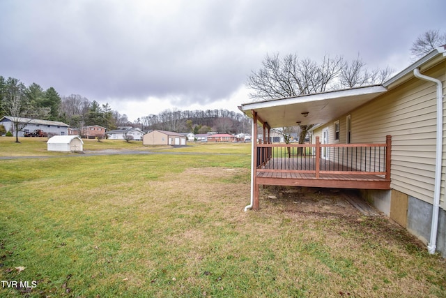 view of yard with a wooden deck