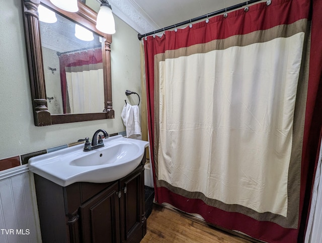 bathroom with vanity, wood-type flooring, and a shower with shower curtain