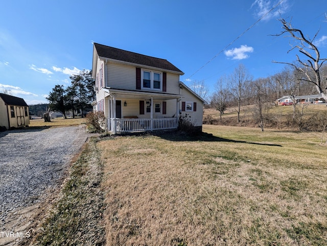 view of front of house featuring a porch and a front yard