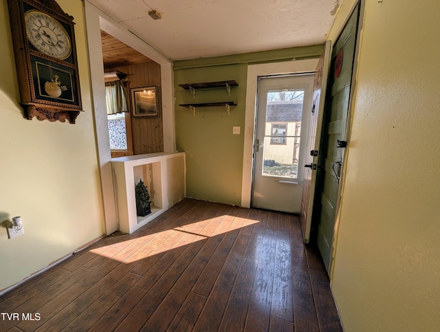 doorway to outside with wood-type flooring