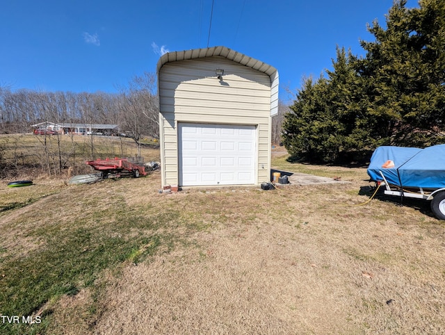 garage with a lawn