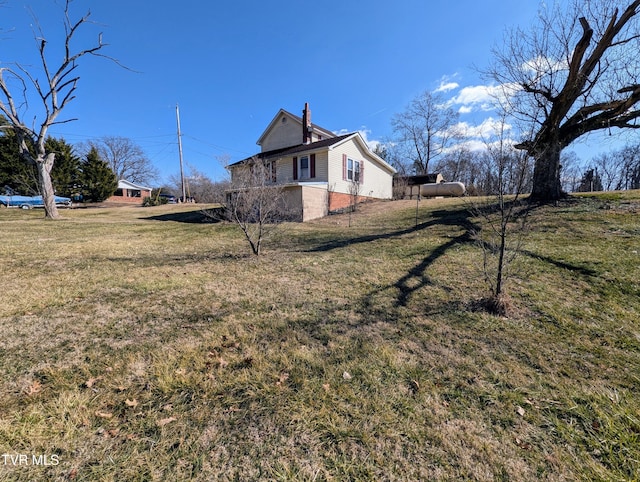 view of property exterior featuring a yard