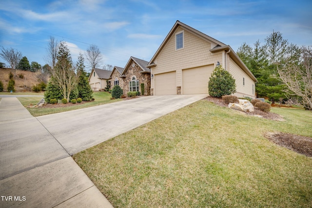 view of front of house featuring a garage and a front lawn