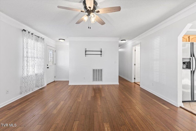 unfurnished living room with ceiling fan, ornamental molding, hardwood / wood-style floors, and a textured ceiling