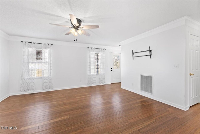 spare room with dark wood-type flooring, ceiling fan, and a textured ceiling