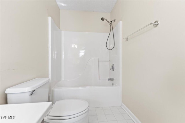 bathroom featuring tile patterned floors, toilet, shower / bath combination, and a textured ceiling