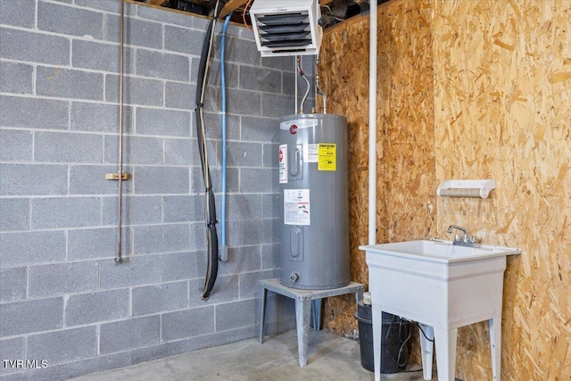 utility room with sink and water heater