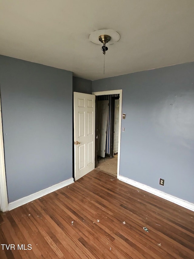 unfurnished room with hardwood / wood-style floors